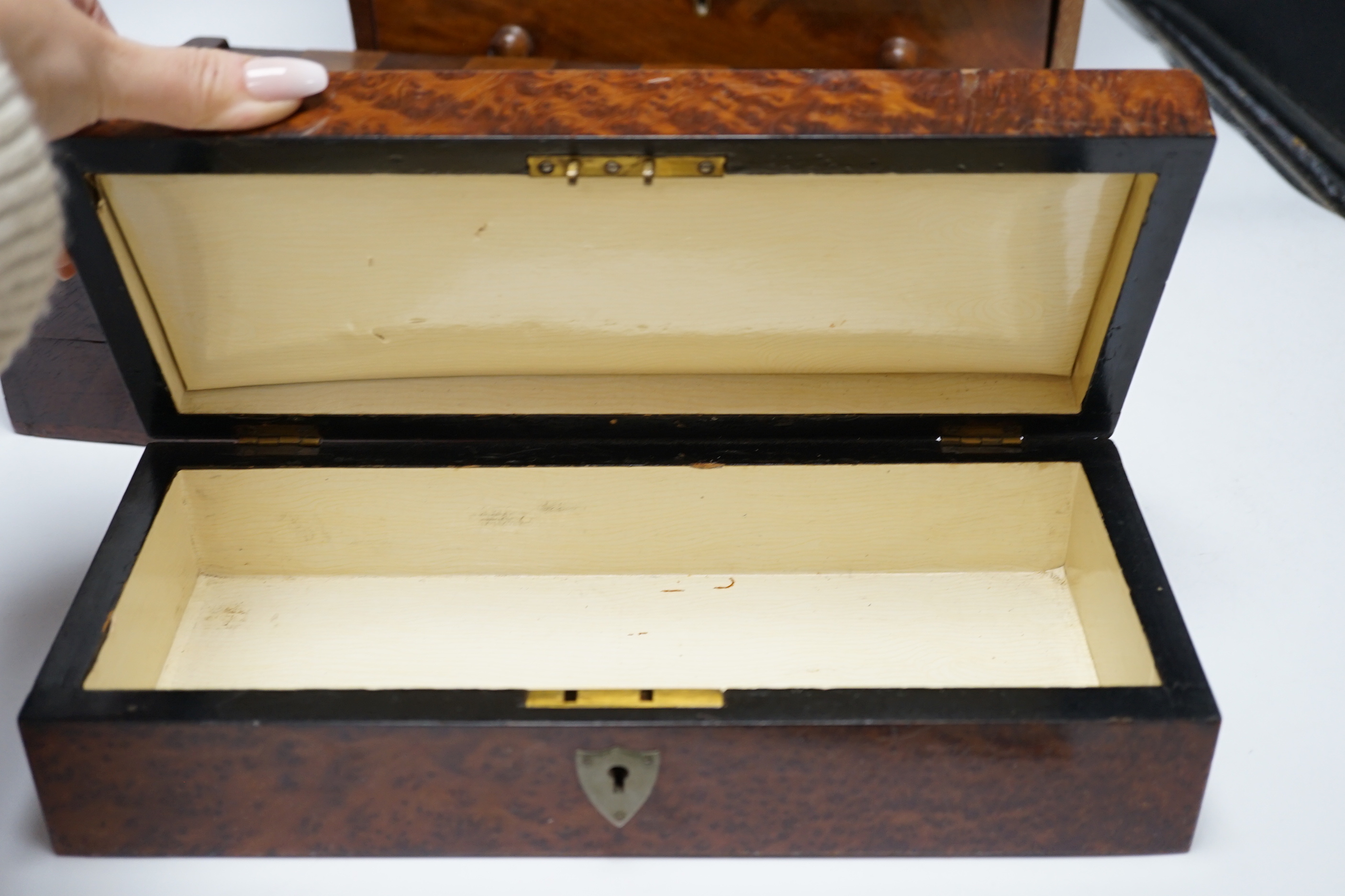 A Victorian mahogany miniature four draw chest, an amboyna glove box and a games box